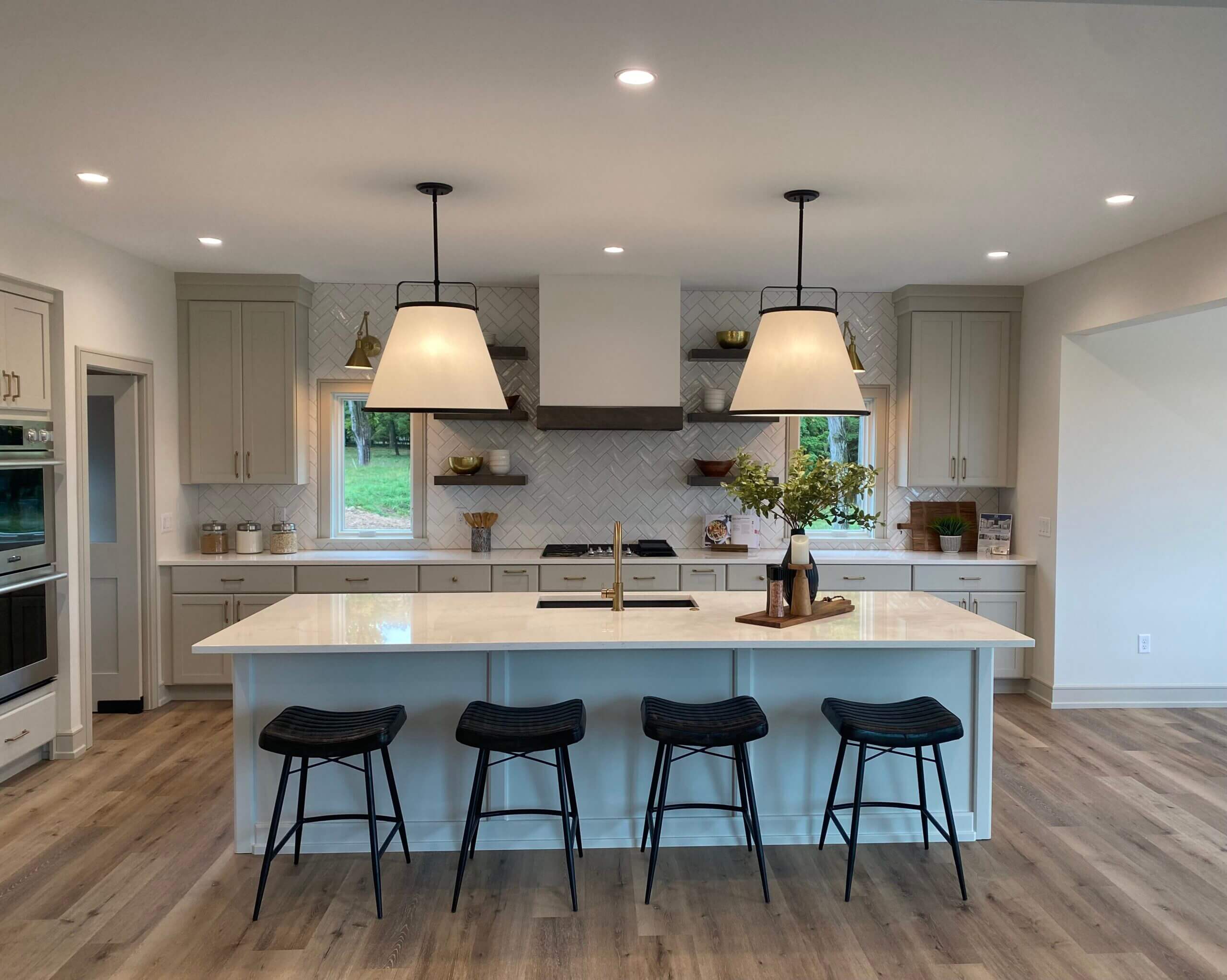 bright white kitchen with four seat island
